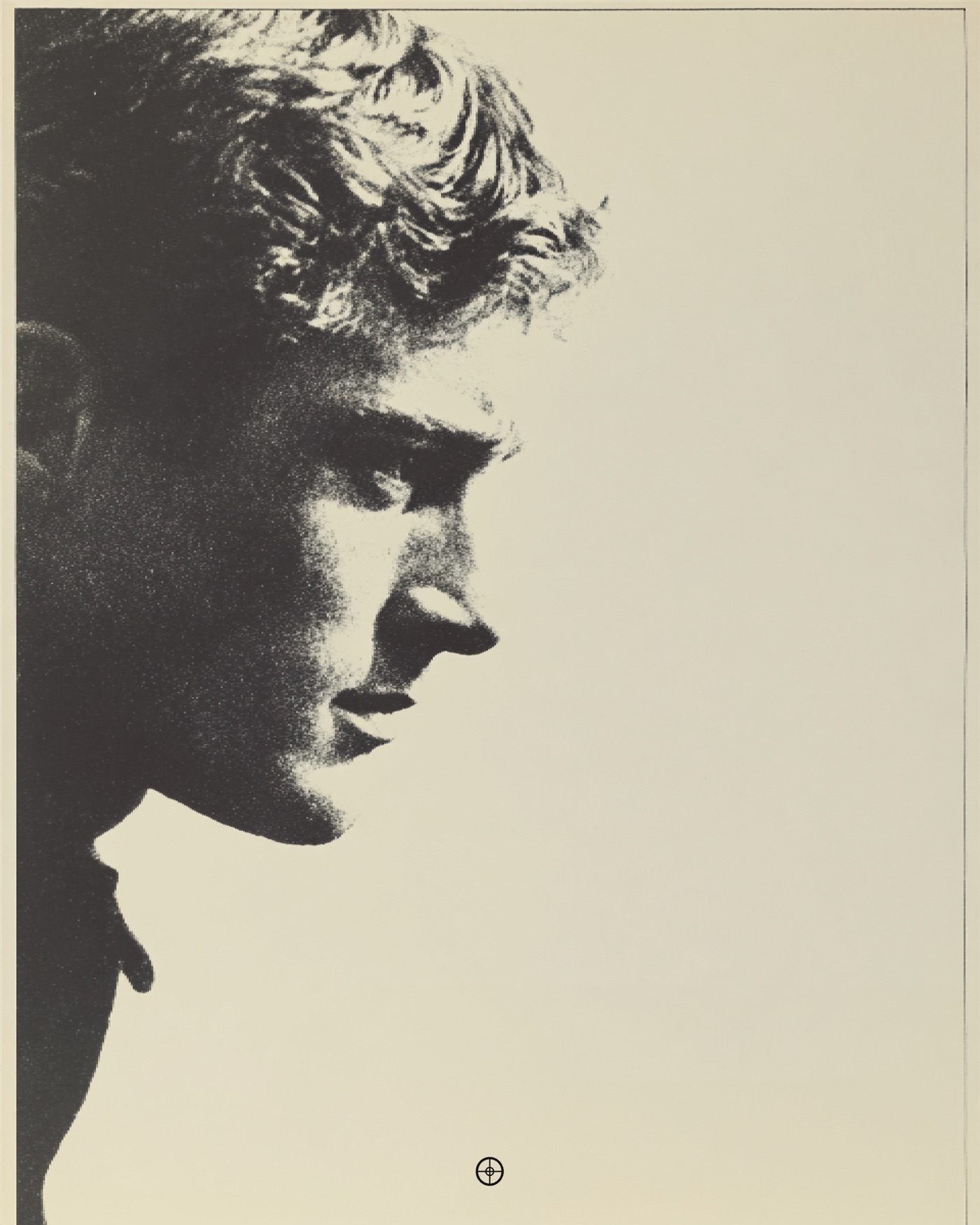 Halftone profile of a young man facing the open paper to his right.